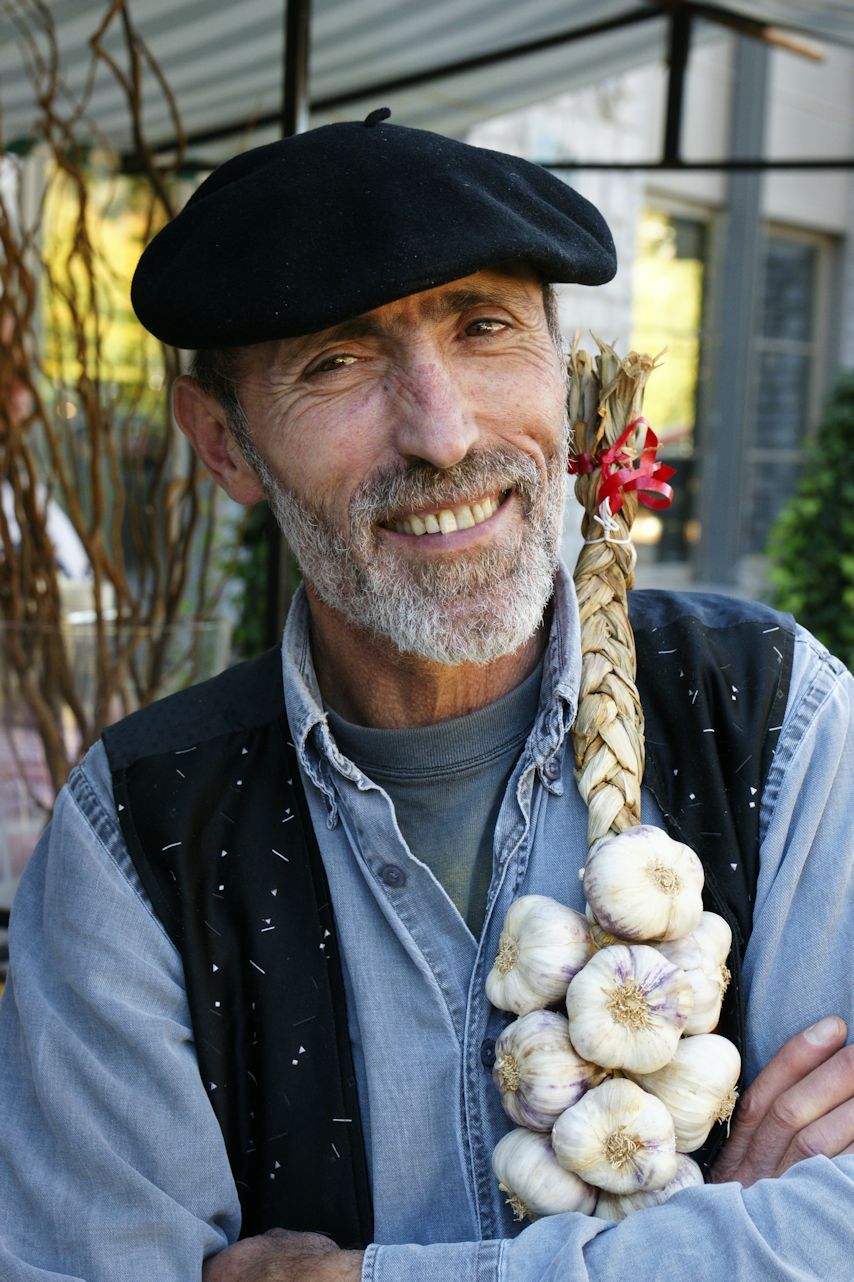 during our visit in Durbuy, this person took all my attention;he was a farmer and was selling biolological fruit and vegetables; the way his hair was dressed together with the garlick strings, did me  decide to take  some pictures of him; and yes he wass ready for  this- Body Sony Alpha 700-Zeiss Zoom 24-70 2.8-ZA SSM-50 mm -1/80 f 6.3-exif 2.21            