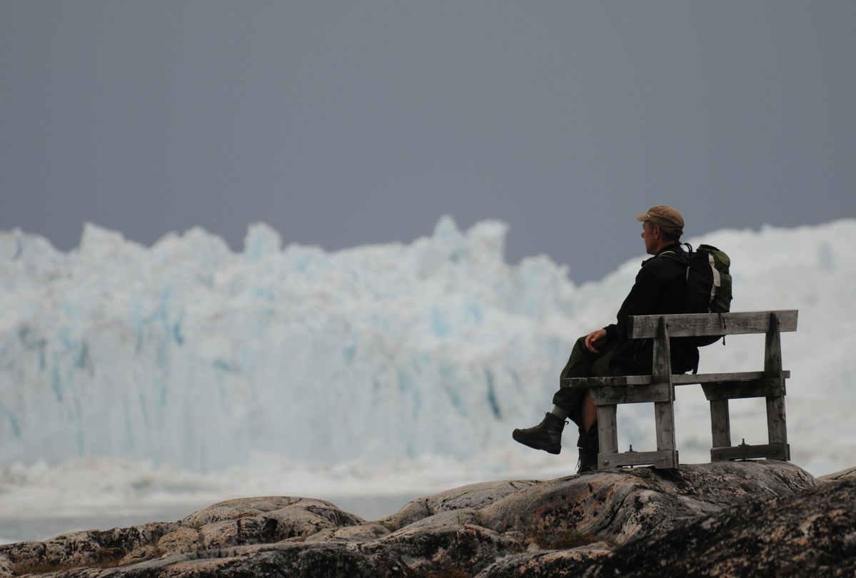 The picture was taken just outside Ilulissat (Jakobshavn), Greenland after a good hike. It was really nice to sit down on this bench and look at the stunning view with giant icebergs (Illulisat means iceberg (plural) in Greenland). The icebergs come from the most productive glacier in the northern hemisphere, Kangia, which pushes out more than 20 million tons of icebergs every day, all year round.